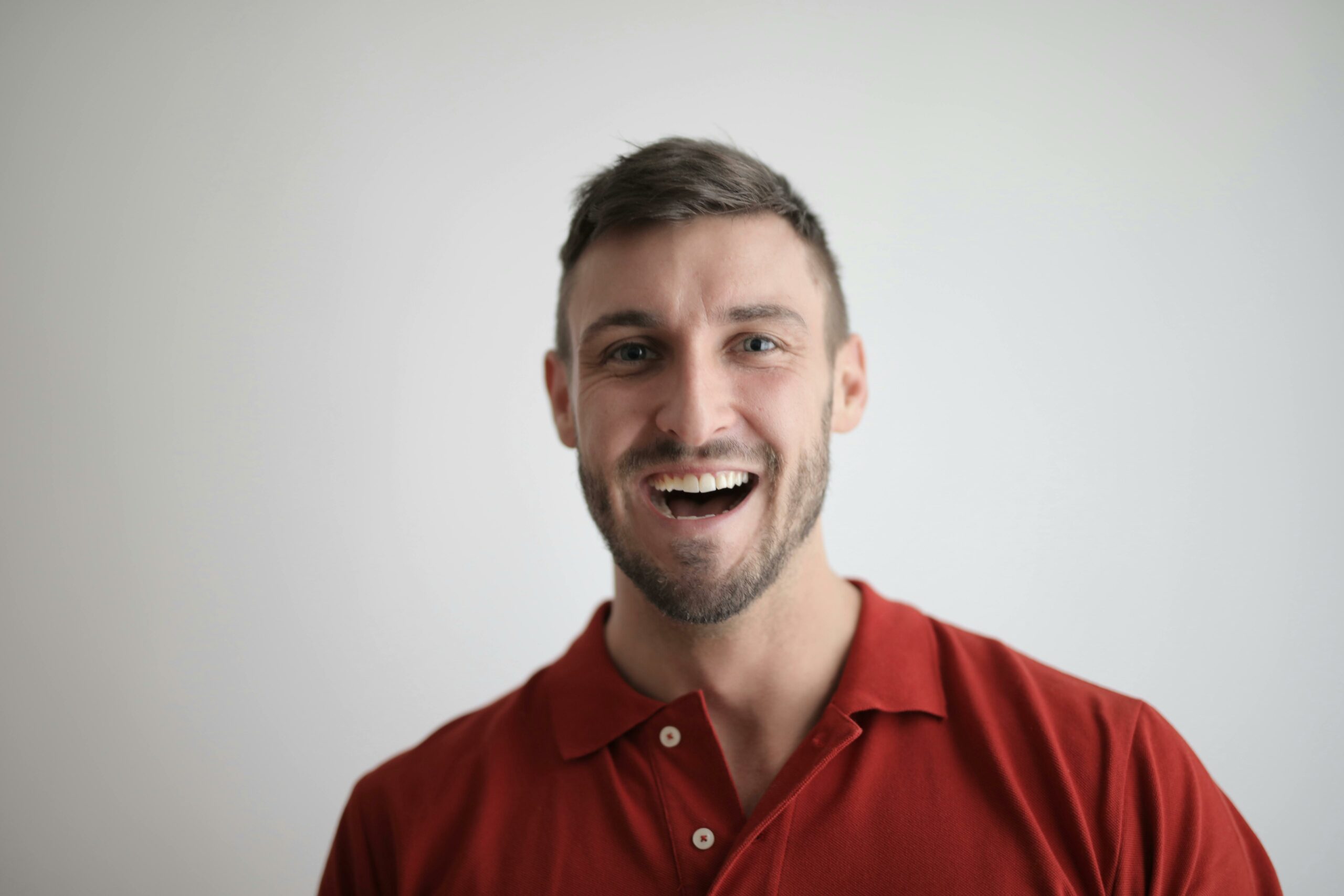 headshot of a young man smiling